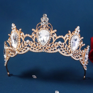 Detailed close-up of Baroque gold bridal crown with pear-shaped rhinestones