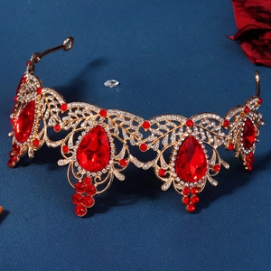 Detailed macro view of gold Baroque bridal crown featuring large red teardrop gemstones