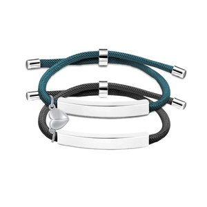 Detail showing a pair of magnetic heart-shaped connectors and woven couple bracelets