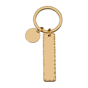 Detail of gold metal keychain featuring a hammered texture rectangular pendant on white background