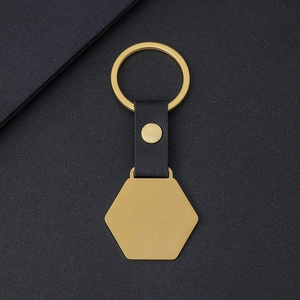 Minimalist hexagon metal keychain with black litchi leather strap in golden finish