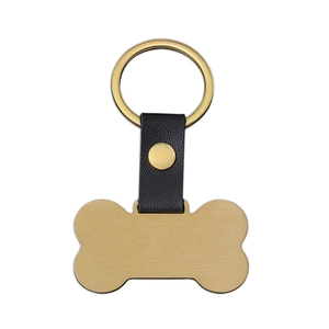 Llavero de cuero negro con placa de metal dorada en forma de hueso para mascotas