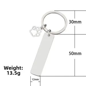 Polished stainless steel rectangle bar keychain with hollow paw print charm pendant