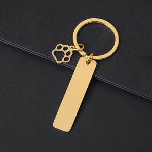 Golden stainless steel keychain with rectangle blank plate and hollow pet paw pendant