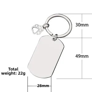 Custom silver dog tag keychain with paw charm for personalized engraving and gifts