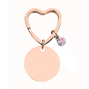 Roségoldener herzförmiger Schlüsselanhänger mit rundem Metallschild und rosa Strassstein
