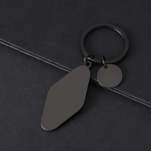 Detailed view of matte black stainless steel keychain with diamond and round blank tags