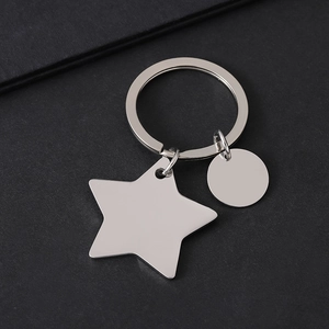 Close-up of polished stainless steel star and circle pendants for custom laser engraving