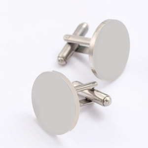 Close-up of polished silver round stainless steel cufflinks with blank surface