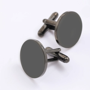 Detailed view of matte black round cufflinks for men featuring a standard T-shaped swivel bar