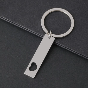 Detailed macro view of silver stainless steel keychain with heart cut-out and mirror polish