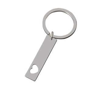 Polished stainless steel rectangular keychain with minimalist heart cutout on white background