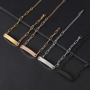 Macro shot of four colors of paperclip link bracelets with smooth curved metal plates