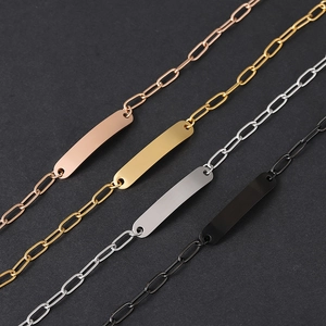 Minimalist paperclip chain bracelet with engravable metal tag in four colors