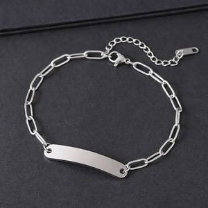 Detail view of silver stainless steel paperclip chain with a blank rectangular metal bar