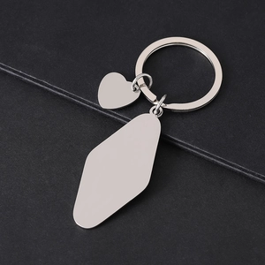 Polished stainless steel keychain with heart and shield pendants for custom engraving