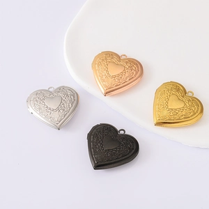 Detailed view of heart locket pendants with floral patterns in four metallic finishes