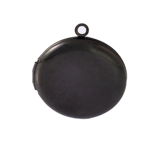 Minimalist round photo locket necklace in brushed black metal on white background