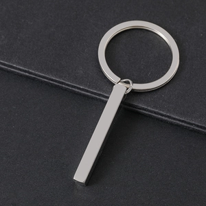 Detailed close-up of a blank solid rectangular pillar pendant on a silver metal keychain