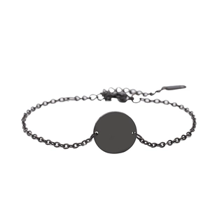 Minimalist black stainless steel chain bracelet with a blank round charm on a white background