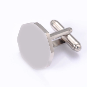 Macro view of a single silver octagonal stainless steel cufflink with T-bar closure