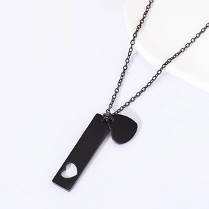 Detail shot of black stainless steel chain necklace with hollow bar and solid heart charms