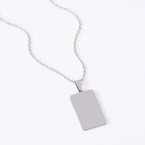Close-up of polished silver rectangular stainless steel pendant for laser engraving