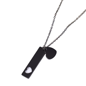 Minimalist black stainless steel bar necklace with heart cutout and small solid heart charm