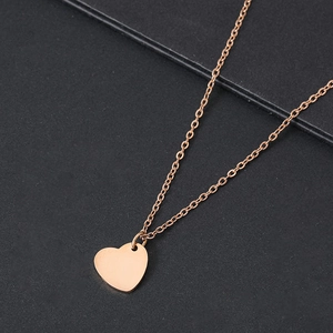 Polished rose gold stainless steel heart pendant necklace with elegant cross chain detail