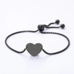 Detail of minimalist black stainless steel heart pendant and adjustable box chain
