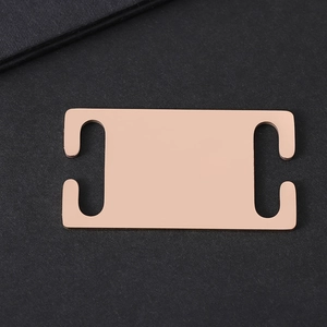 Detailed macro view of polished rose gold slide-on stainless steel pet ID tag