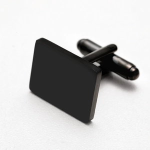Close-up of rectangular matte black stainless steel cufflinks for men's formal shirts