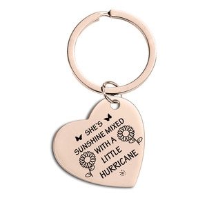 Rose gold heart keychain with sunflower engraving and inspirational quote on white background