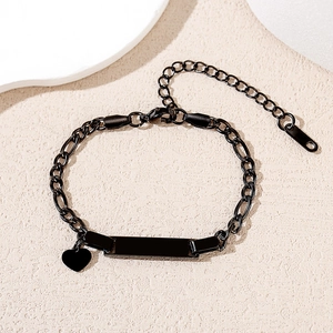Detailed close-up of a black stainless steel Cuban chain bracelet with customizable bar