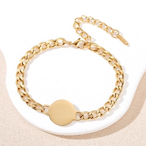 Polished gold stainless steel Cuban link bracelet with engravable round pendant and clasp