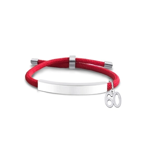 Detailed macro view of the red braided cord bracelet with a polished metal number 60 charm