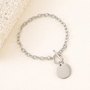 Detail of silver stainless steel O-chain bracelet with OT clasp and blank round pendant