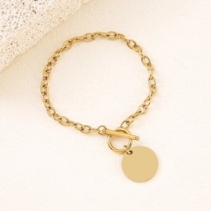Elegant gold stainless steel link bracelet with OT toggle clasp and round pendant charm