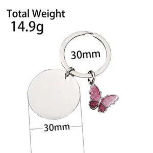Silver stainless steel keychain with pink glitter butterfly pendant and circular metal tag