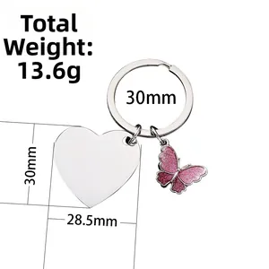 Detail view showing pink butterfly charm and heart pendant dimensions on a keychain
