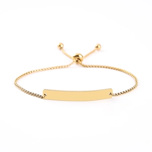 Adjustable gold box chain bracelet with a smooth blank curved metal bar for engraving