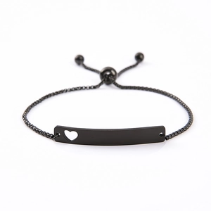 Detail showing matte black stainless steel bar bracelet with heart cutout and box chain