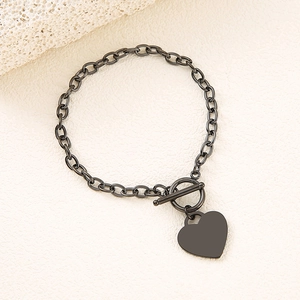 Close-up of gunmetal O-chain bracelet with smooth heart tag and functional OT toggle clasp
