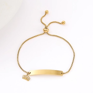 Adjustable gold stainless steel bracelet with a curved plate and small crown charm
