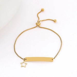 Detailed shot of golden stainless steel bar bracelet with hollow star charm and slide clasp