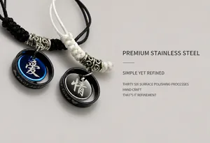 Detail of hand-woven couple bracelets with stainless steel rings and love engravings