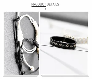 Detail of couple bracelets with forever love engraving on black and white woven rope band