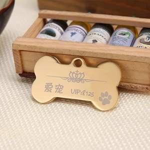 Polished bone-shaped gold stainless steel pet ID tag with custom crown and paw engraving