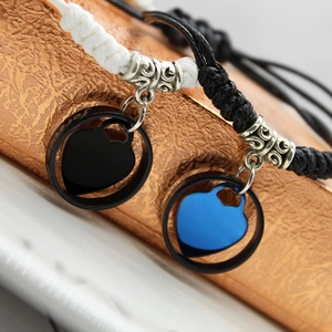 Couples braided rope bracelets with Forever engraved rings and heart charms