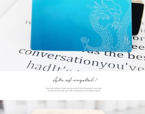 Close-up of 0.2mm blue metallic aluminum card featuring an intricate dragon laser engraving